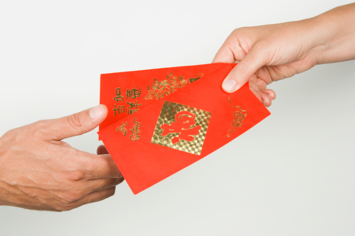 Hong bao or ang pao in red money packets or envelopes